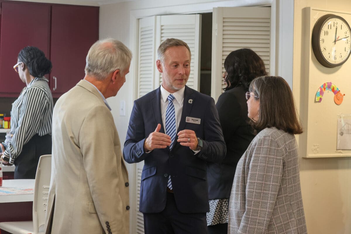 Greg Smith, executive director of the University of Arkansas at Little Rock’s MidSOUTH Training Academy, discusses the new Child Welfare Learning Lab with University of Arkansas System President Jay B. Silveria and Christina S. Drale, chancellor of UA Little Rock.
