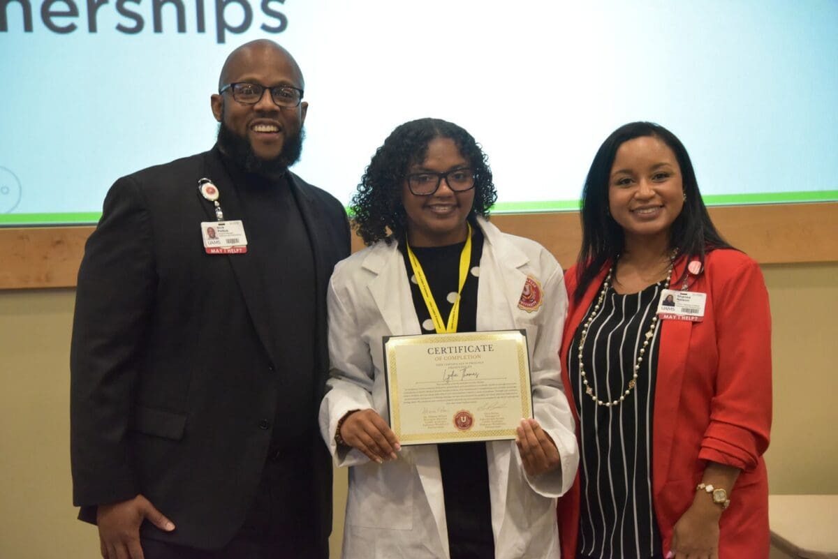 Lydia Thomas (center) pictured with Nick Pettus, Manager of Student Recruitment at UAMS (left), and Dr. Shanea’ Nelson, Executive Director of Pathways Academy at UAMS (right).