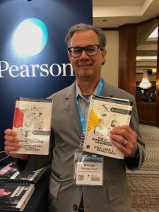 Michael Greer with the Little, Brown Handbooks at CCCC 2018 in Kansas City, MO.