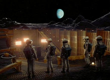 Still image from movie "2001: A Space Odyssey" showing astronauts standing on lunar surface