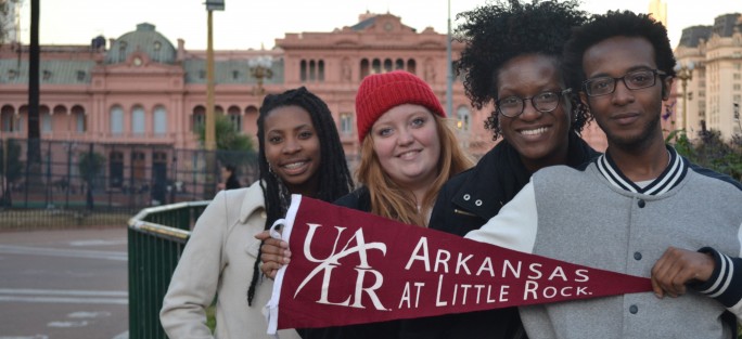 Students holding UALR flag in Argentina
